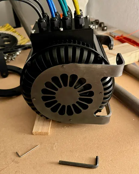 The motor with its cover fitted, mounted in the frame