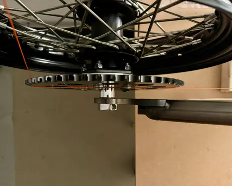 The rear sprocket bolted to the wheel hub, seen from below