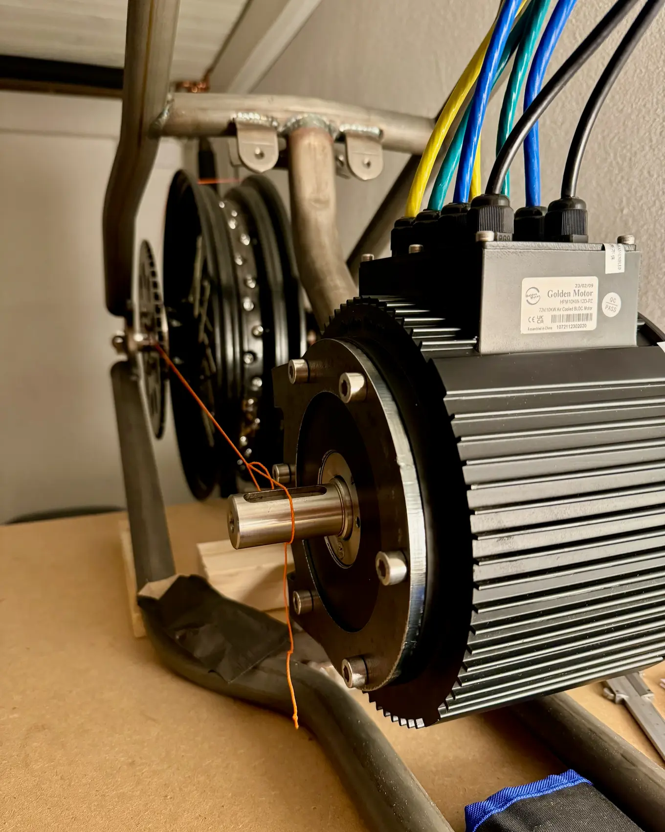 The motor's drive sprocket lined up with the rear sprocket behind it