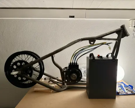 The frame on its wheels with the controller box standing beside it