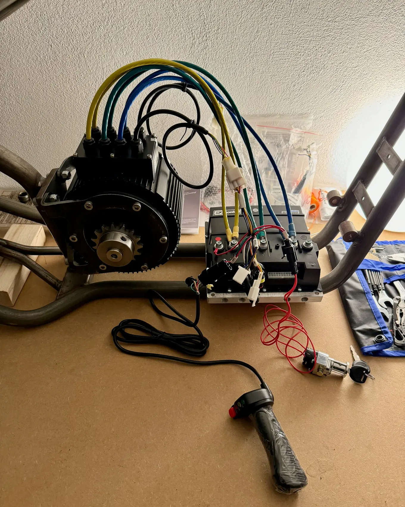 The throttle and its cable on the bench