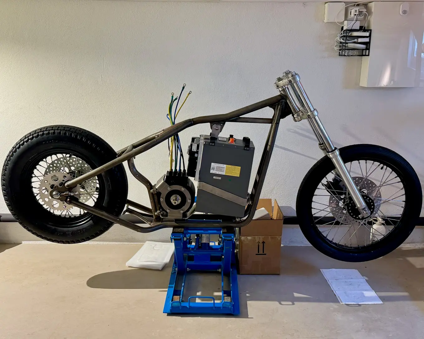The rolling chassis standing on the garage floor