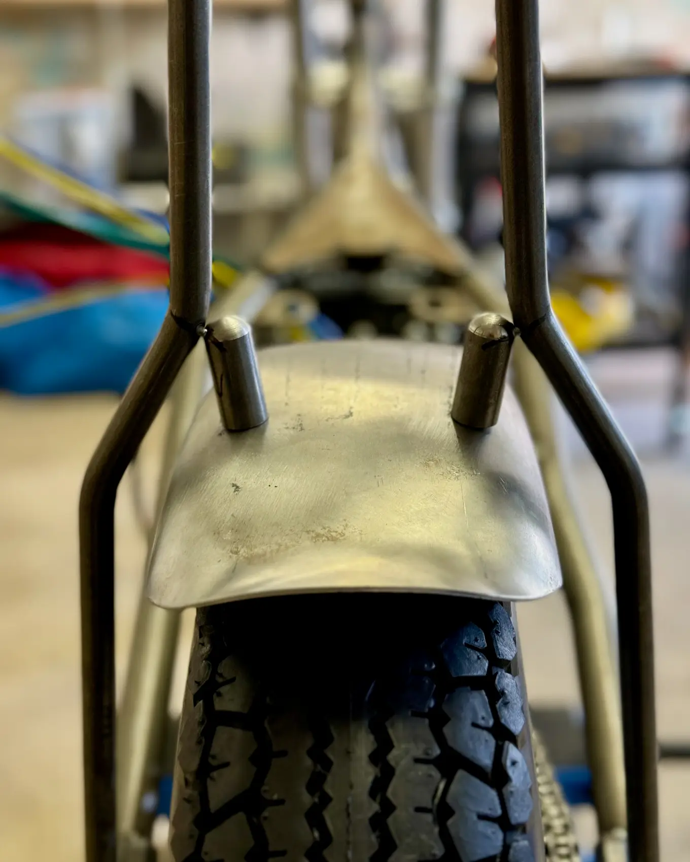 The rear fender shaped over the tire, seen from behind