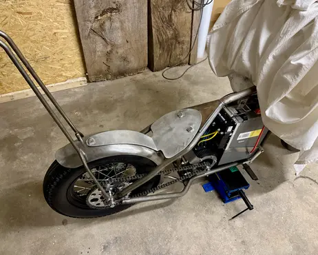 The bike pushed into the corner of the garage