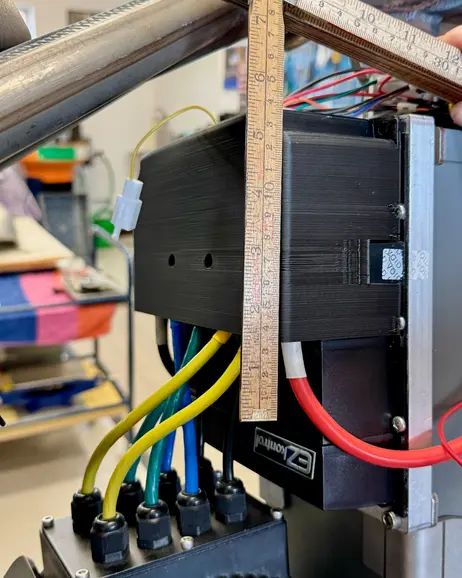 A rule held against the electronics to measure the space