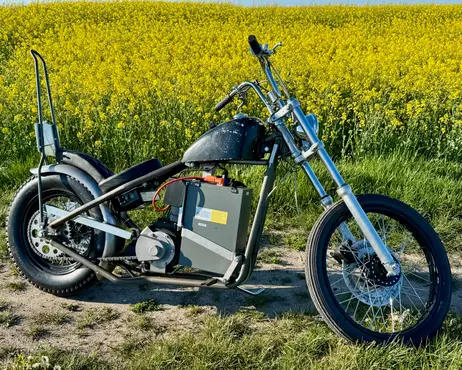 The bike standing at the edge of a rapeseed field in bloom