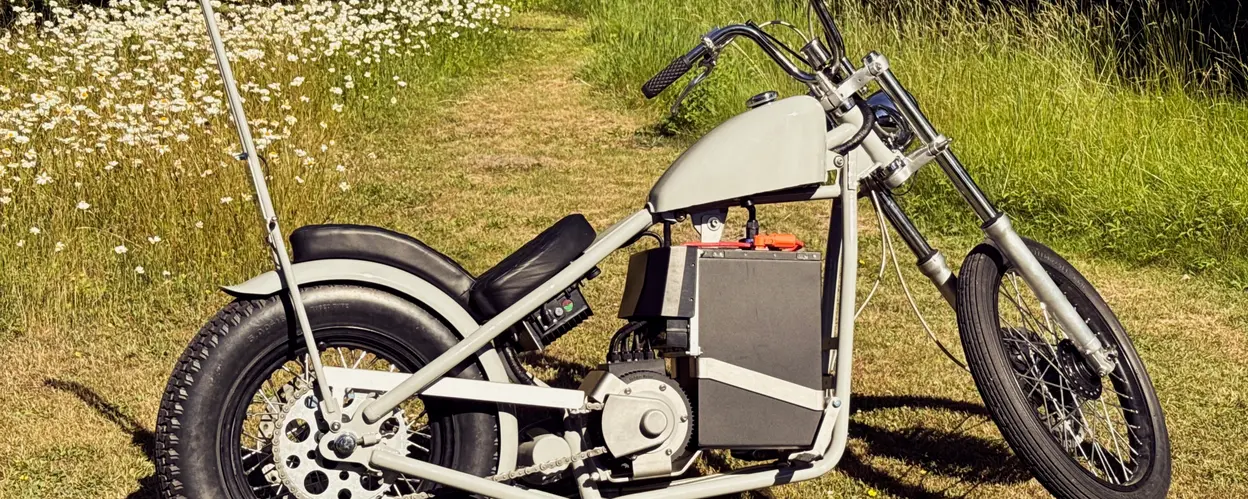 The chopper as it stands, in a field of long grass and daisies